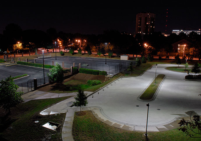 Streetlights powered on during nighttime hours.