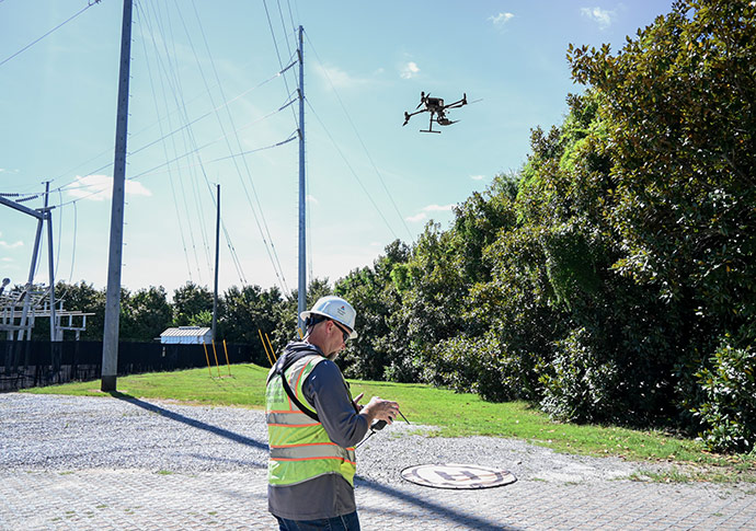 FAA drone pilot inspects transmission lines to detect issues before they become a problem.