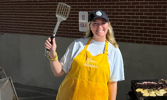 Tess makes breakfast for crews on her flat top grill