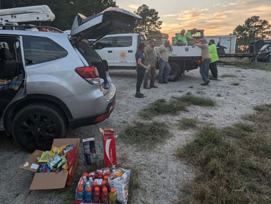 Cars are loaded with supplies for a morning distribution