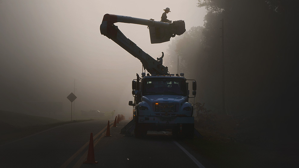 lineworkers restoring power in the early morning