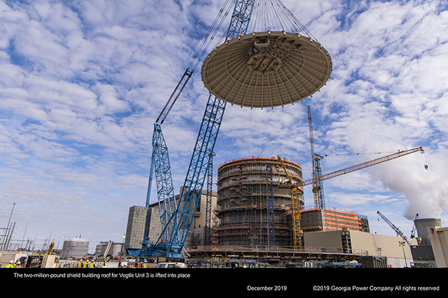 The two million pound shield building roof for Vogtle Unit 3 is lifted into place