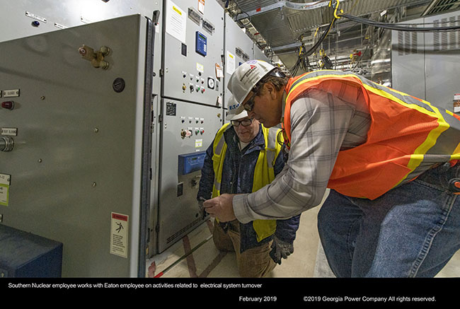 Southern Nuclear employee works with Eaton employee on activities related to electrical system turnover