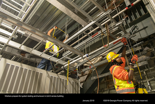 Workers prepare for systems and turnover in Unit 3 annex building